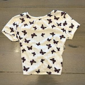 Small white cropped tie back t shirt with butterfly’s on it